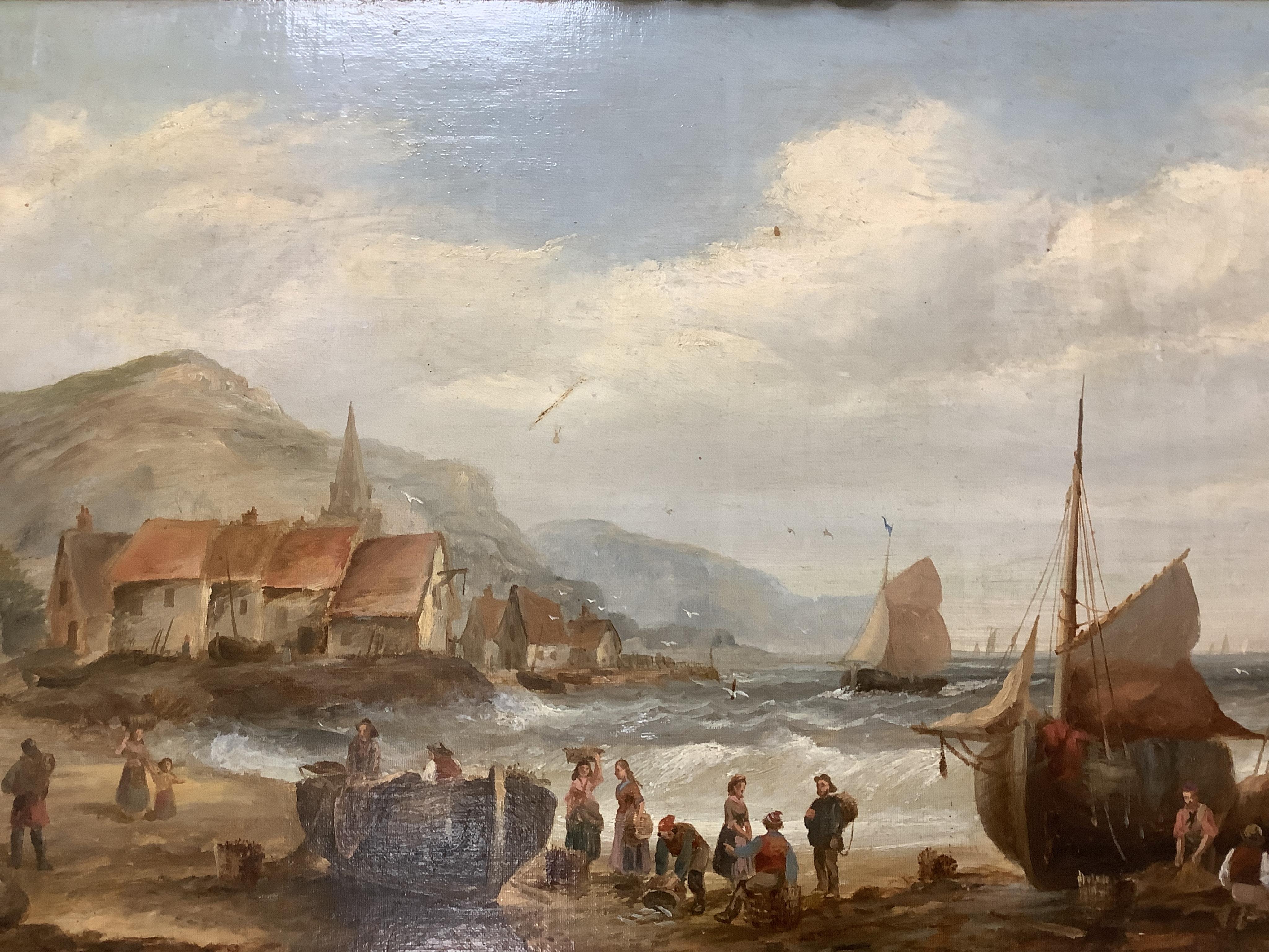 British School, 19th century, oil on canvas, Beach scene with figures, fishing boats, village and hills beyond, 37 x 67cm. Condition - fair, some losses to the paint